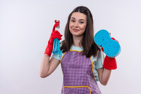 young-beautiful-girl-apron-rubber-gloves-holding-cleaning-spray-sponge-looking-camera-with-happy-face-smiling-1